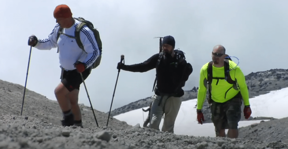 Three men hiking in the snow