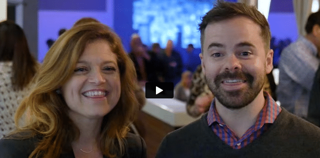 Two people smiling at the camera