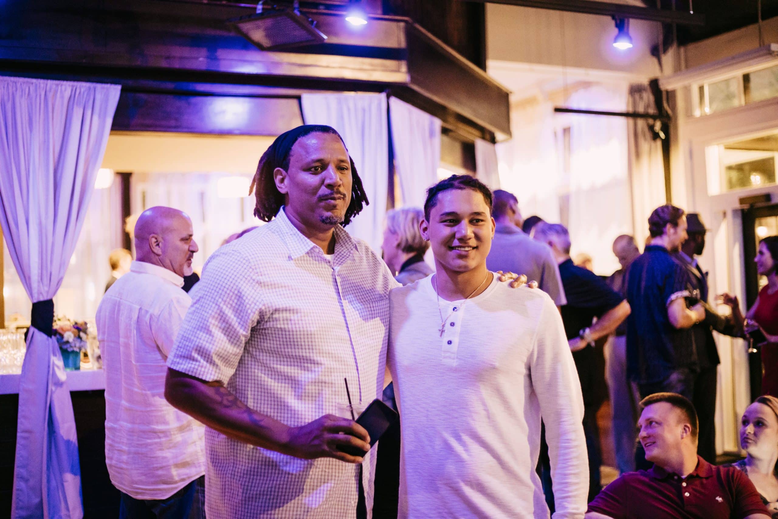 Two people having their picture taken at an event