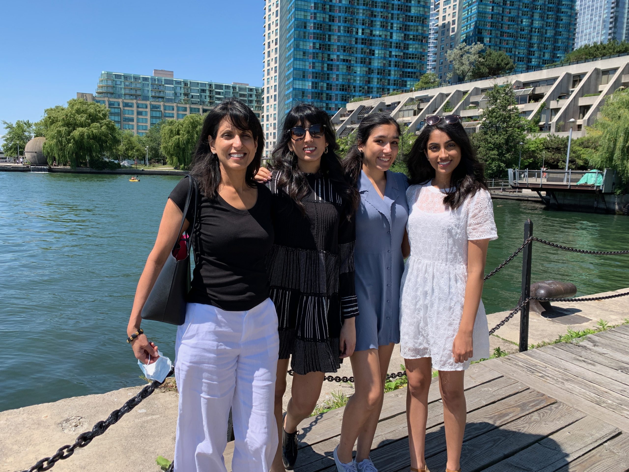 Four women standing on a dock