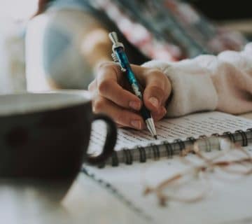 selective focus photography of pen